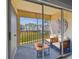 Comfortable balcony seating area with outdoor view at 8703 Bardmoor Blvd # 203, Seminole, FL 33777