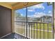 Balcony view looking to the green space and other apartments at 8703 Bardmoor Blvd # 203, Seminole, FL 33777