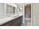 Bathroom featuring a modern sink and vanity with bathtub at 8703 Bardmoor Blvd # 203, Seminole, FL 33777