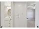 Hallway view of vanity with cabinet storage and bedroom access at 8703 Bardmoor Blvd # 203, Seminole, FL 33777