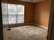 Bedroom featuring a large window and neutral carpeting at 10114 Winsford Oak Blvd # 517, Tampa, FL 33624