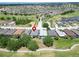Aerial view of a community surrounding a golf course, multiple ponds, and lush landscaping at 1102 Emerald Dunes Dr, Sun City Center, FL 33573