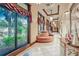 Bright hallway with large windows, comfortable seating, and tasteful decor, providing a welcoming atmosphere at 1102 Emerald Dunes Dr, Sun City Center, FL 33573