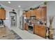 Functional kitchen with stainless steel appliances and ample cabinet space at 1102 Emerald Dunes Dr, Sun City Center, FL 33573