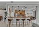 Kitchen showcasing a breakfast bar with seating and views into adjacent rooms at 1102 Emerald Dunes Dr, Sun City Center, FL 33573