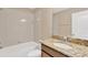 Bathroom featuring a tub and shower combo with a granite countertop vanity at 1210 Trailwater St, Ruskin, FL 33570