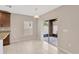 Dining area featuring tile floors, a window, and sliding door access to the porch at 1210 Trailwater St, Ruskin, FL 33570