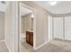 Hallway with view of a bathroom with a granite vanity at 1210 Trailwater St, Ruskin, FL 33570