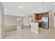 Eat-in kitchen with stainless steel appliances and adjacent to the living room at 1210 Trailwater St, Ruskin, FL 33570