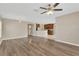Open-concept floor plan with wood flooring and a view into the kitchen at 1210 Trailwater St, Ruskin, FL 33570