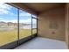 Screened in back patio with a view of the backyard and neighborhood at 1210 Trailwater St, Ruskin, FL 33570