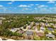A vibrant aerial view of a well-planned residential community with mature trees and attractive single-Gathering homes at 13096 Linzia Ln, Spring Hill, FL 34609