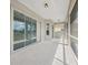 Covered patio with tiled floor, sliding glass doors, and view of backyard at 13096 Linzia Ln, Spring Hill, FL 34609