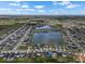 Aerial view of a planned community featuring multiple lakes, single Gathering homes, and well manicured lawns at 13821 Kinsale St, Riverview, FL 33579