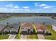 These lakeside homes feature beautiful water views and lush lawns at 13821 Kinsale St, Riverview, FL 33579