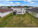 Expansive backyard featuring a screened patio, ideal for enjoying outdoor living and entertaining at 13821 Kinsale St, Riverview, FL 33579