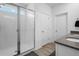 Modern bathroom with a glass-enclosed shower, sleek vanity, and neutral tile flooring at 13821 Kinsale St, Riverview, FL 33579