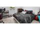 A bedroom featuring desk, and dark-colored bedding and carpeted floors, perfect for relaxing at 13821 Kinsale St, Riverview, FL 33579