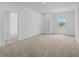 Large bedroom with natural light and door access to another room, perfect for relaxation at 13821 Kinsale St, Riverview, FL 33579
