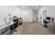 Versatile bonus room featuring neutral walls, sewing machines, desk, and ample lighting at 13821 Kinsale St, Riverview, FL 33579