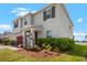 Beautiful two-story home with a covered front porch and lovely landscaping at 13821 Kinsale St, Riverview, FL 33579