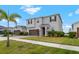 Attractive two-story home with a manicured front lawn and a cozy, inviting entrance at 13821 Kinsale St, Riverview, FL 33579