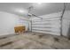 Clean garage space with an automatic door, ready for parking and storage at 13821 Kinsale St, Riverview, FL 33579