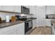 Well-equipped kitchen with stainless steel oven, white cabinets and counter top space at 13821 Kinsale St, Riverview, FL 33579