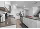 Spacious kitchen featuring stainless steel appliances, ample counter space, and white cabinets at 13821 Kinsale St, Riverview, FL 33579