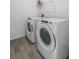 Modern laundry room with front-loading washer and dryer at 13821 Kinsale St, Riverview, FL 33579