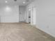 Spacious living room area with carpet floors and access to an adjacent room at 13821 Kinsale St, Riverview, FL 33579