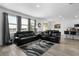Welcoming living room with plush couches, large windows with water view, and an open-concept design at 13821 Kinsale St, Riverview, FL 33579