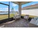 Relaxing screened-in porch with outdoor seating overlooking a serene lake view at 13821 Kinsale St, Riverview, FL 33579