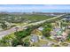 Coastal community aerial view showcasing neighborhood, roadways, bridges, and distant waterfront buildings at 14006 79Th Ave, Seminole, FL 33776