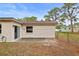 Home exterior of backyard with concrete patio and fence at 14006 79Th Ave, Seminole, FL 33776