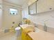 Charming bathroom with colorful vanity and floral patterned wallpaper at 14006 79Th Ave, Seminole, FL 33776