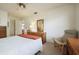 Bright bedroom features wood furniture, neutral carpet, and a ceiling fan for added comfort at 14006 79Th Ave, Seminole, FL 33776