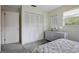 Bedroom featuring closet, wicker dresser, mirror and plush carpet at 14006 79Th Ave, Seminole, FL 33776
