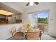 Bright dining space with chairs and table set for meal at 14006 79Th Ave, Seminole, FL 33776