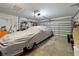 Attached garage featuring a covered vehicle and ample storage space at 14006 79Th Ave, Seminole, FL 33776