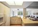 Eat-in kitchen with retro cabinets and countertops, ceiling fan, and lots of natural light at 14006 79Th Ave, Seminole, FL 33776