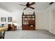 Open-concept living room with built-in shelving, plush carpet, and ample natural light, creating a welcoming space at 14006 79Th Ave, Seminole, FL 33776