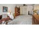 Cozy living room featuring a comfy couch, soft carpet, and built-in wooden shelves at 14006 79Th Ave, Seminole, FL 33776
