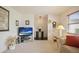 Inviting living room featuring bright walls, carpeted floors, a glass coffee table, and ample natural light at 14006 79Th Ave, Seminole, FL 33776