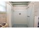 Classic shower with tiled walls, a curtain, and neutral finishes for a timeless appeal at 14006 79Th Ave, Seminole, FL 33776