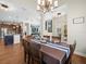 Dining area open to kitchen and living room, perfect for entertaining guests at 14209 Quintessa Ln, Lithia, FL 33547