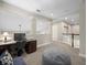 This upper floor home office space offers a large desk area and comfortable seating at 14209 Quintessa Ln, Lithia, FL 33547