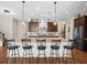 Spacious kitchen island with seating, stainless appliances, and granite counters at 14209 Quintessa Ln, Lithia, FL 33547
