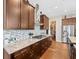Gourmet kitchen with stainless appliances, custom cabinetry, and a walk in pantry at 14209 Quintessa Ln, Lithia, FL 33547