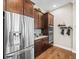Kitchen showcases stainless steel refrigerator, built in microwave and oven, and ample cabinet storage at 14209 Quintessa Ln, Lithia, FL 33547
